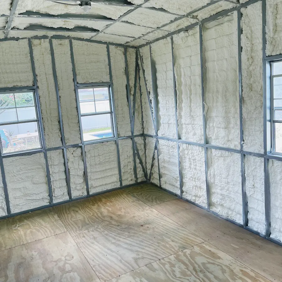 Closed-cell spray foam insulation applied to wall cavities in a residential project in Ludlow